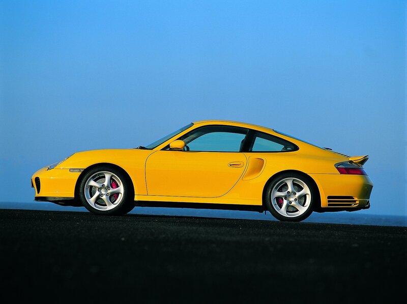 yellow porsche sports car