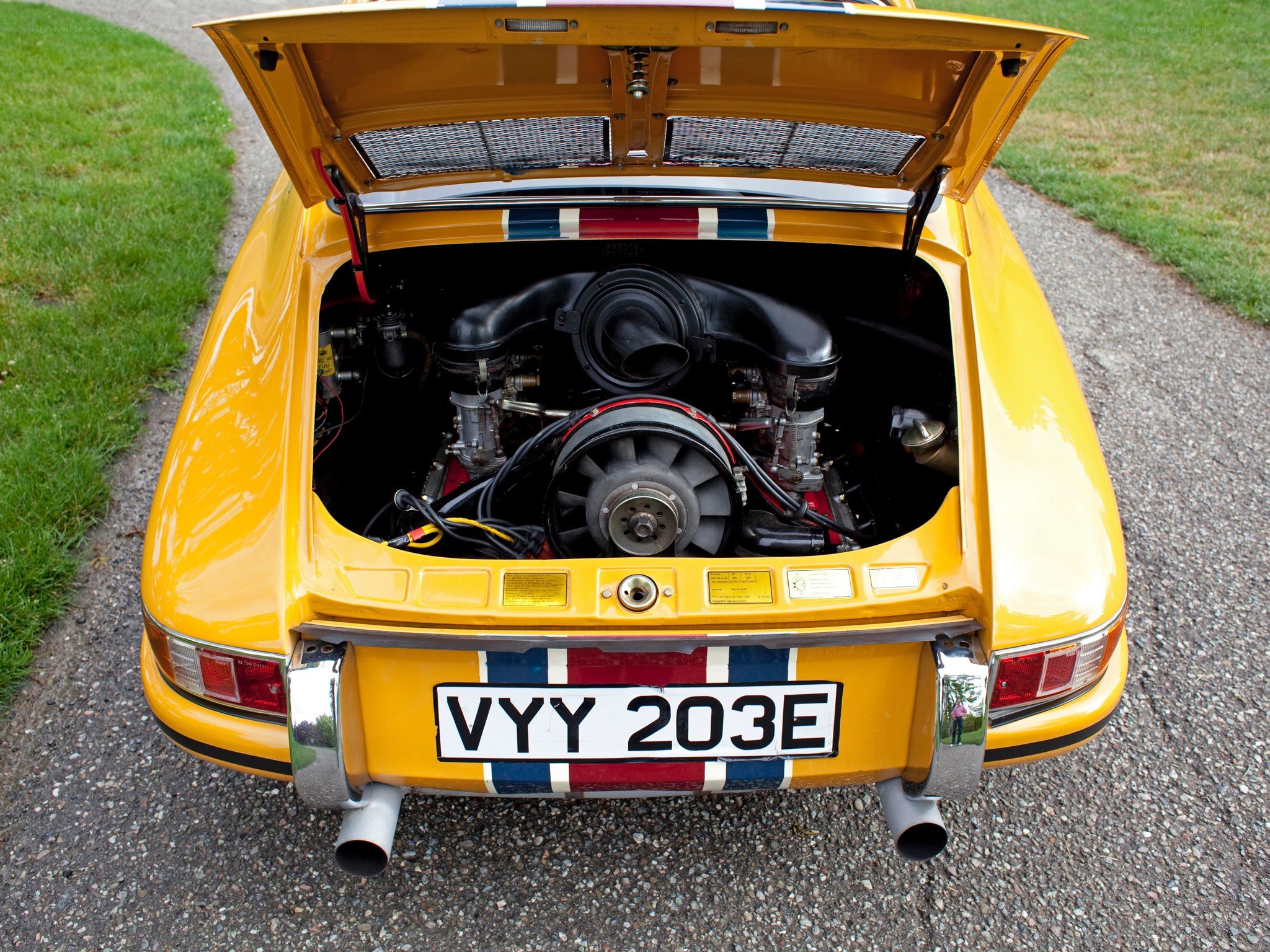 yellow porsche with open engine bay