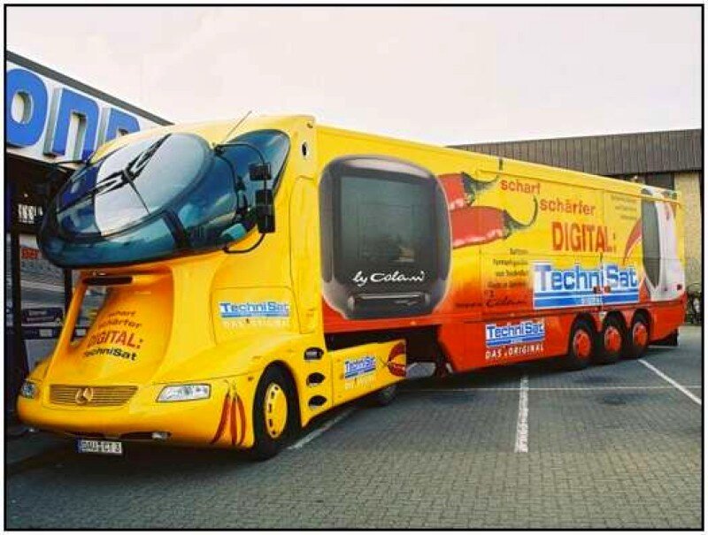 Yellow promotional bus with digital TV ad