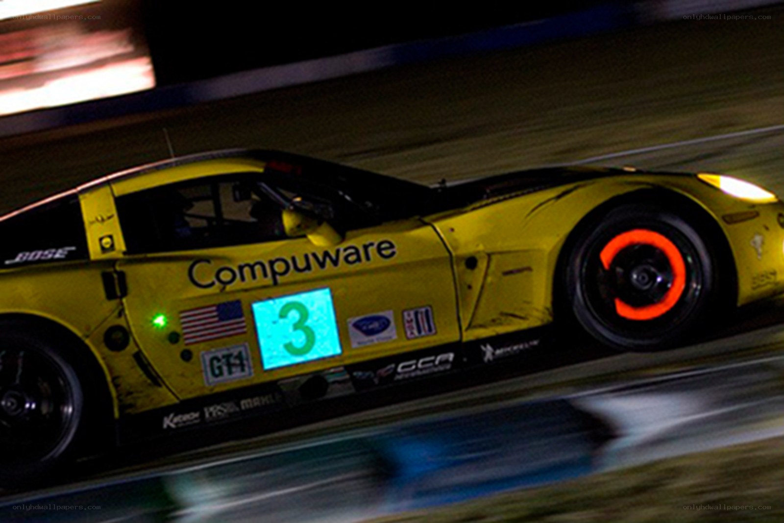 yellow race car at night
