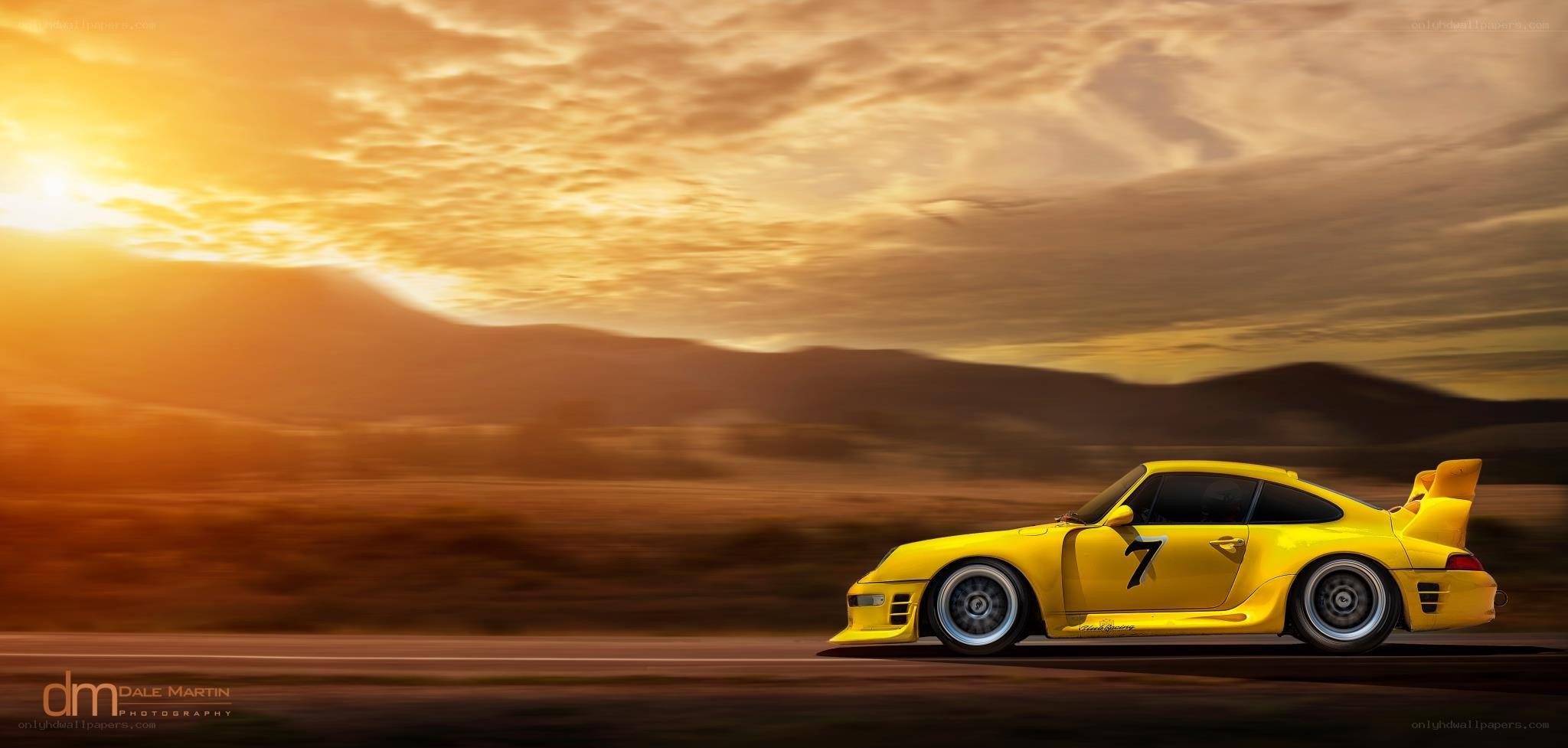 Yellow race car at sunset