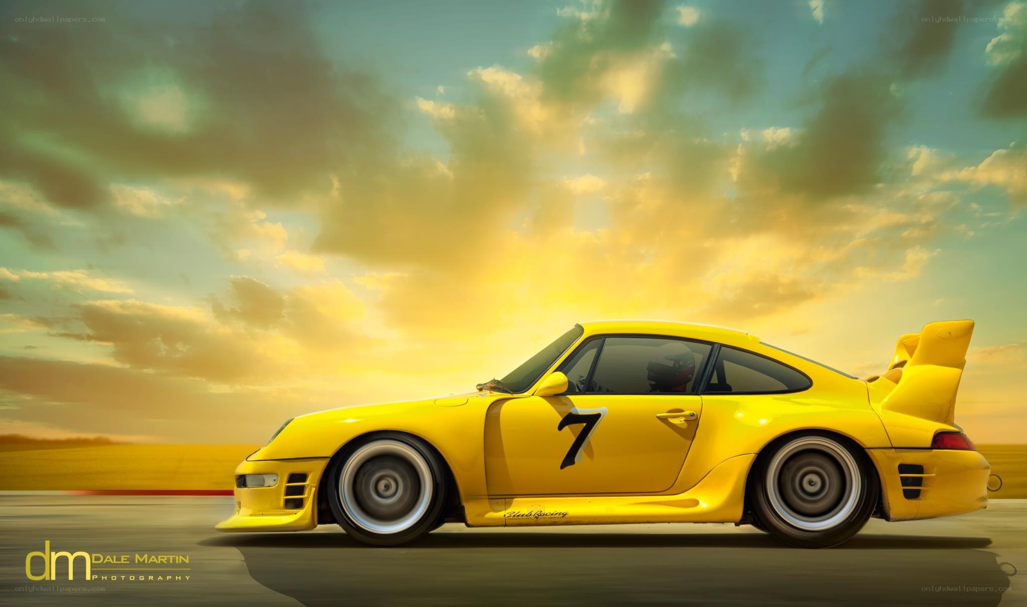 Yellow race car at sunset
