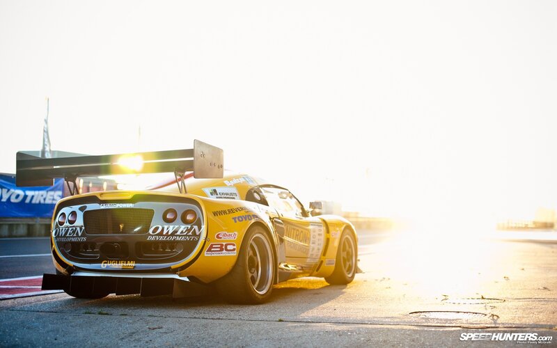 yellow race car at sunset