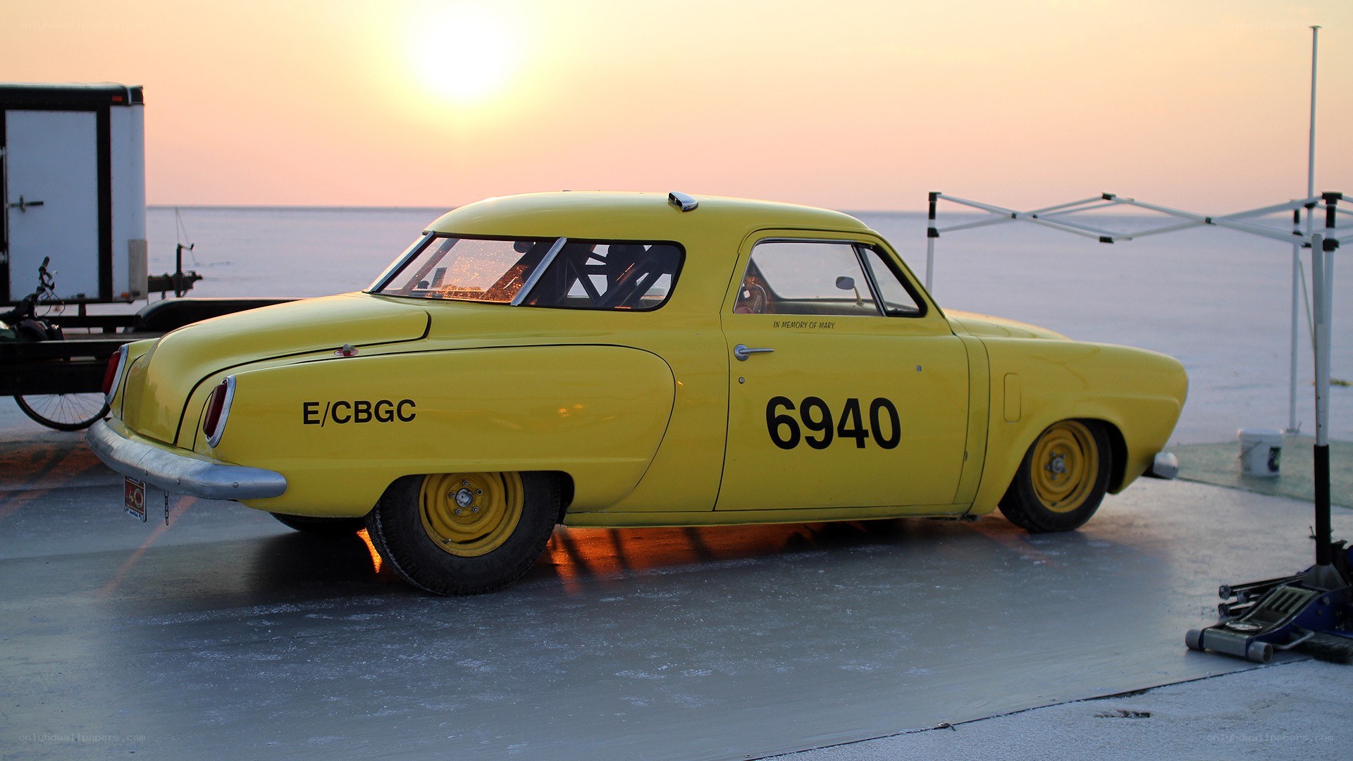 Yellow race car at sunset