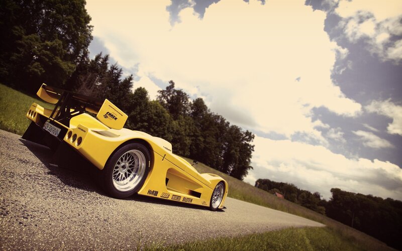 Yellow Race Car — Dramatic, Afternoon, Photograph, Road, Trees