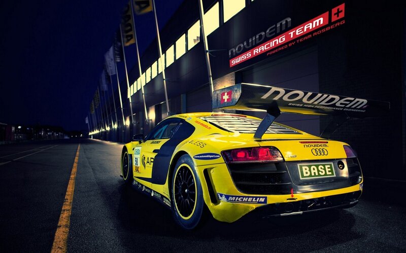 Yellow Race Car — Dramatic, Night, Photograph, Race Car, Building, Tire