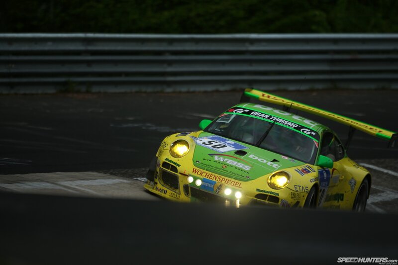 Yellow Race Car — Dramatic, Night, Photograph, Race Track, Guardrail