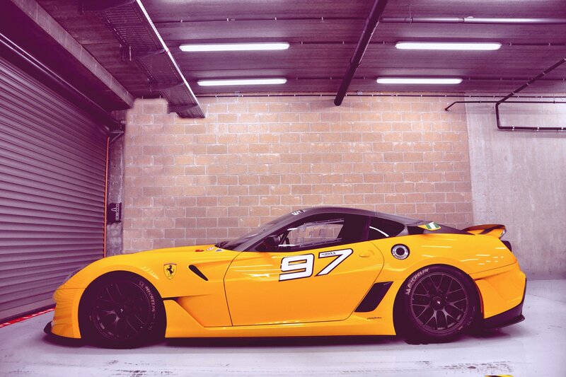 Yellow Race Car — Dramatic, Photograph, Brick Wall