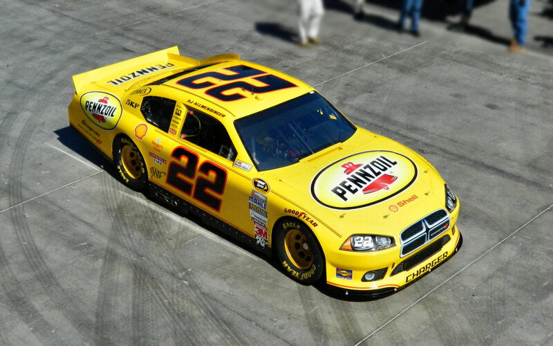 Yellow Race Car — Dynamic, Afternoon, Photograph, Race Track, People
