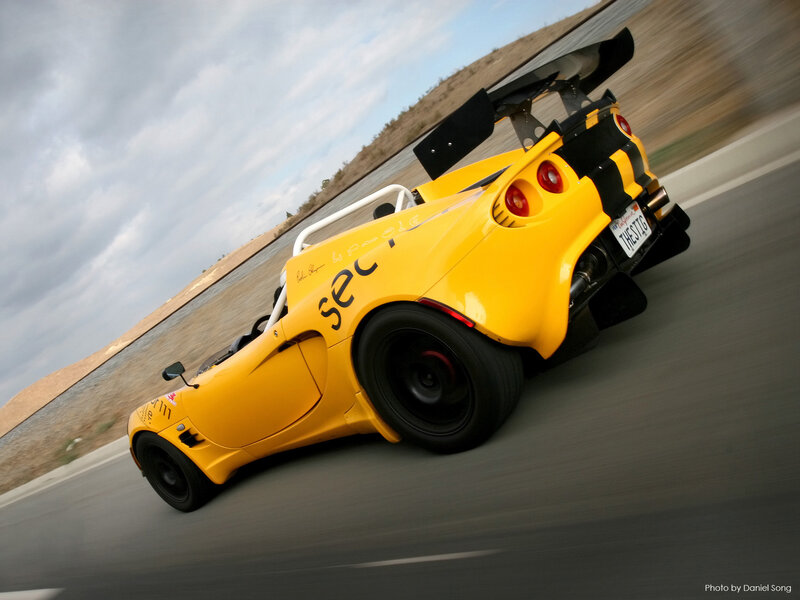 Yellow Race Car — Dynamic, Afternoon, Photograph, Race Track, Sky, Tire