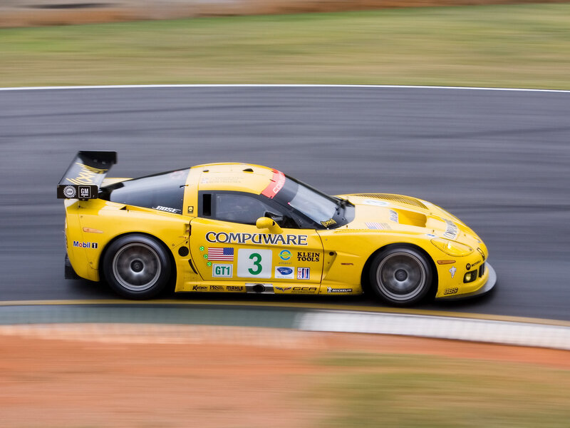Yellow Race Car — Dynamic, Photograph, Race Track, Sponsor Logos, Number 3