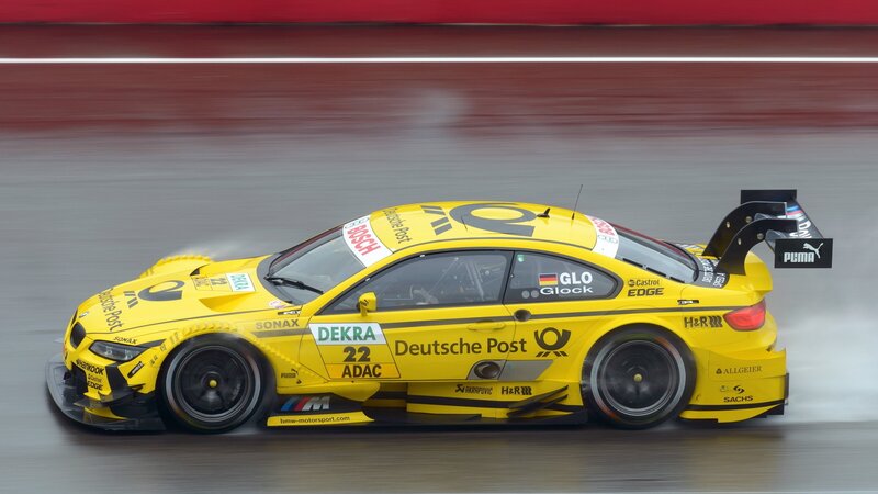 Yellow Race Car — Dynamic, Photograph, Race Track, Sponsor Logos, Tire Smoke, Black