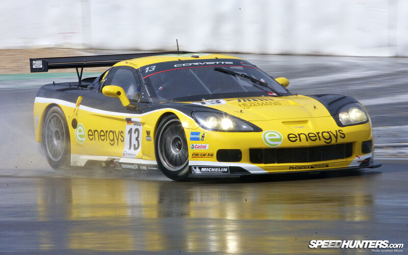Yellow Race Car — Dynamic, Photograph, Race Track, Wet Surface, Tire Spray