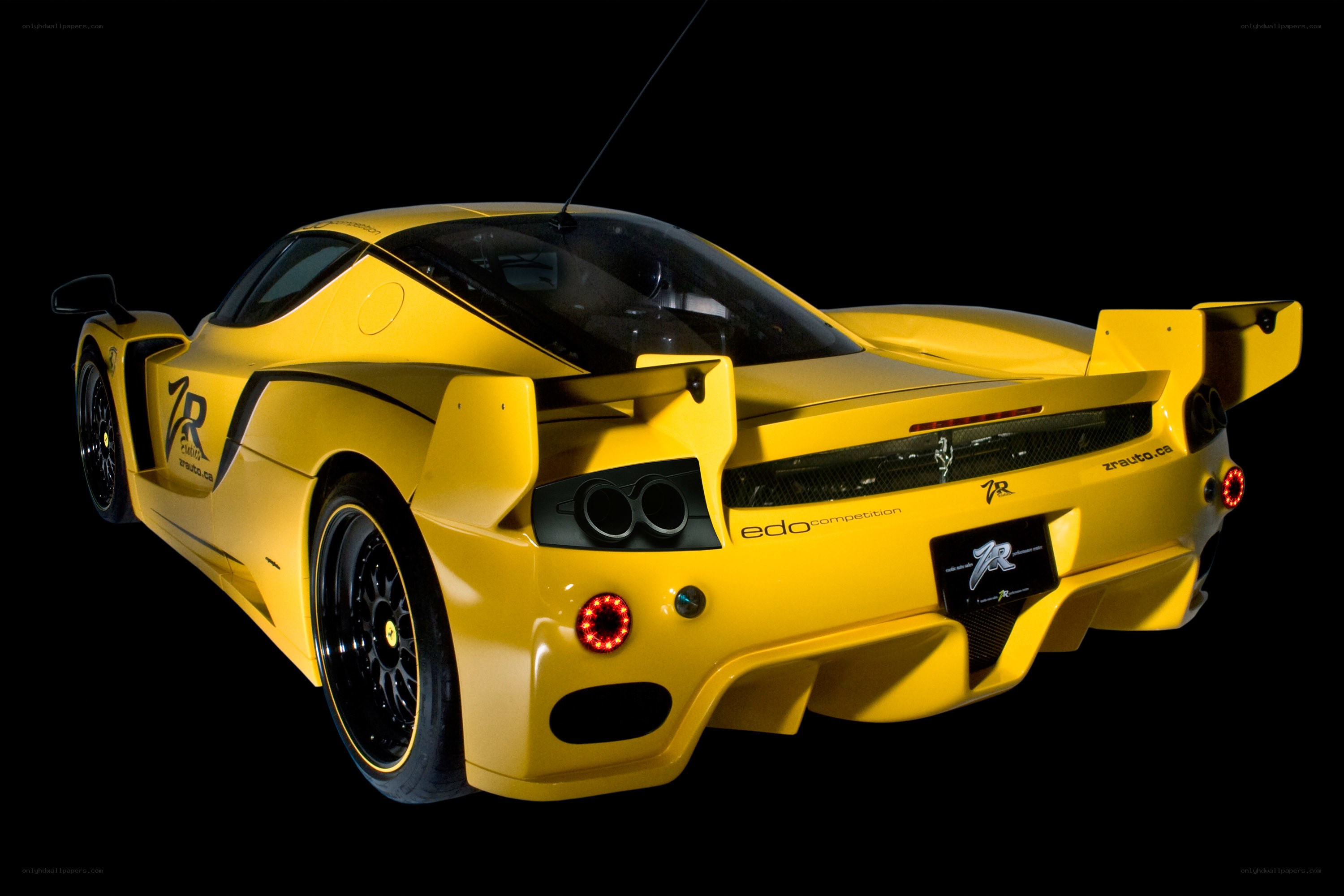 yellow race car from rear