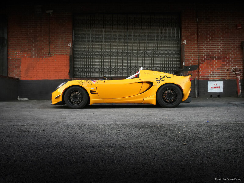 Yellow race car in alley