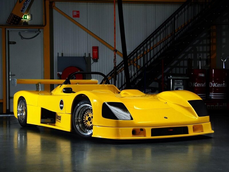 yellow race car in garage