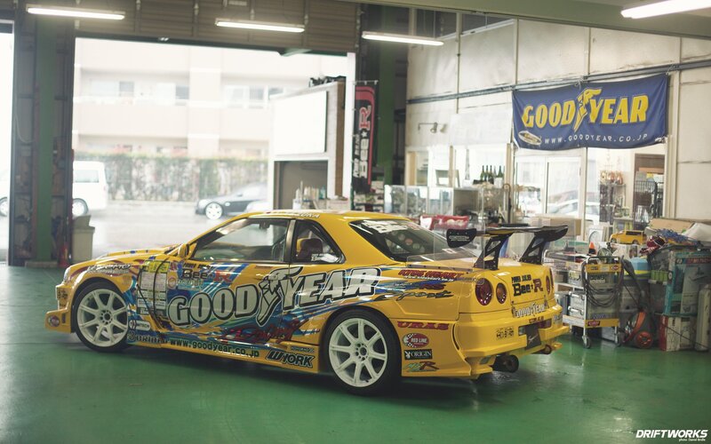 Yellow race car in garage