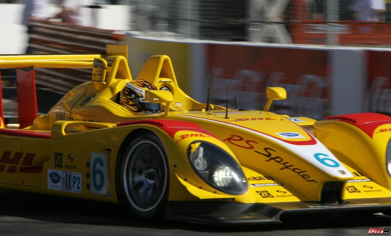 yellow race car in motion