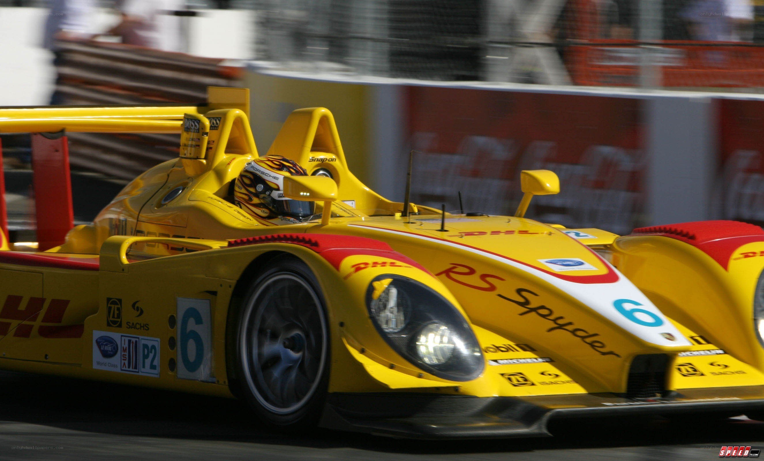 yellow race car in motion