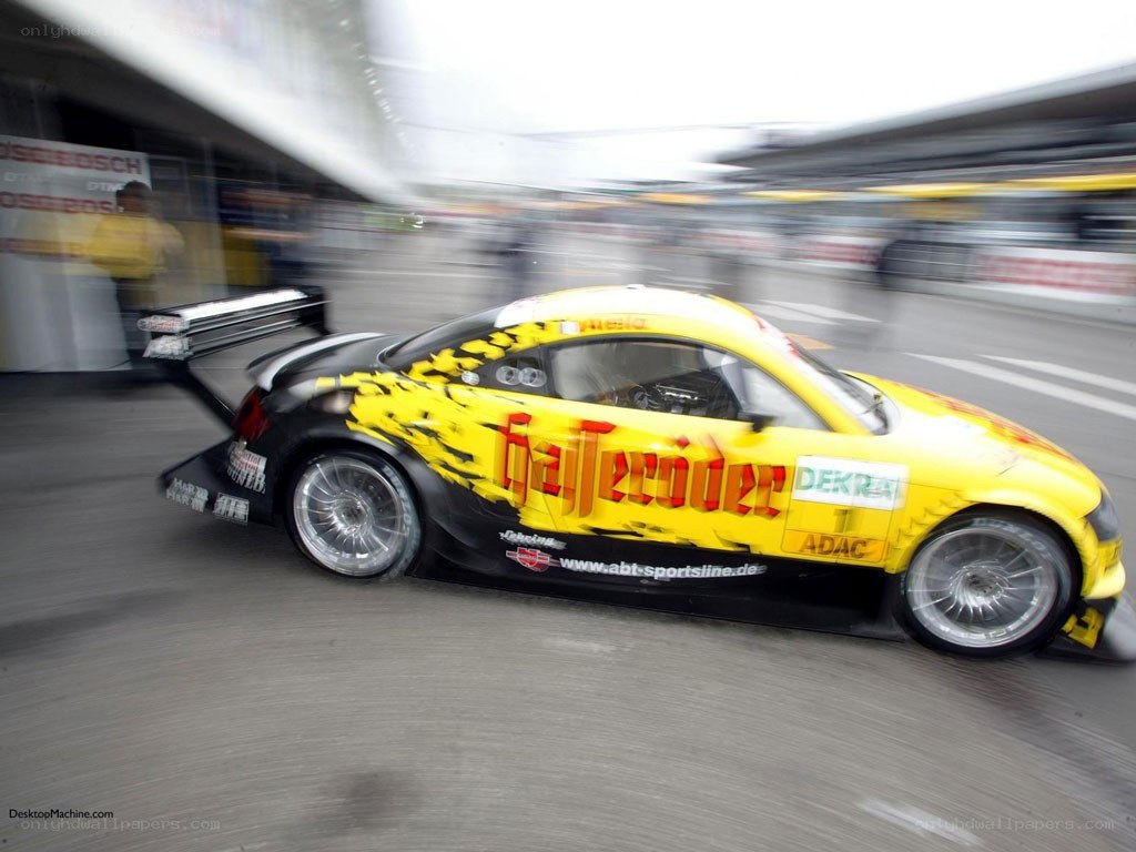 yellow race car in motion