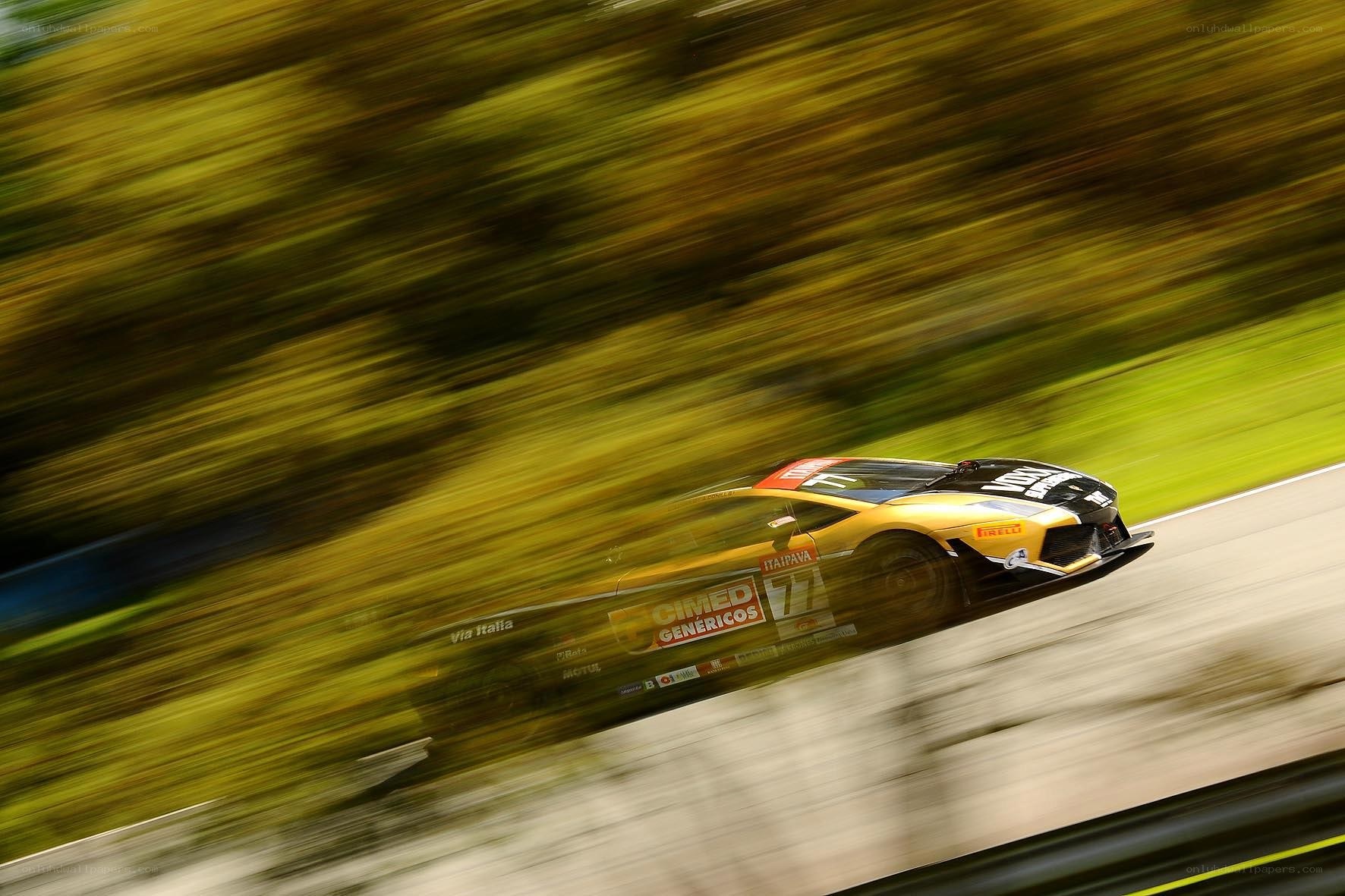 Yellow race car in motion