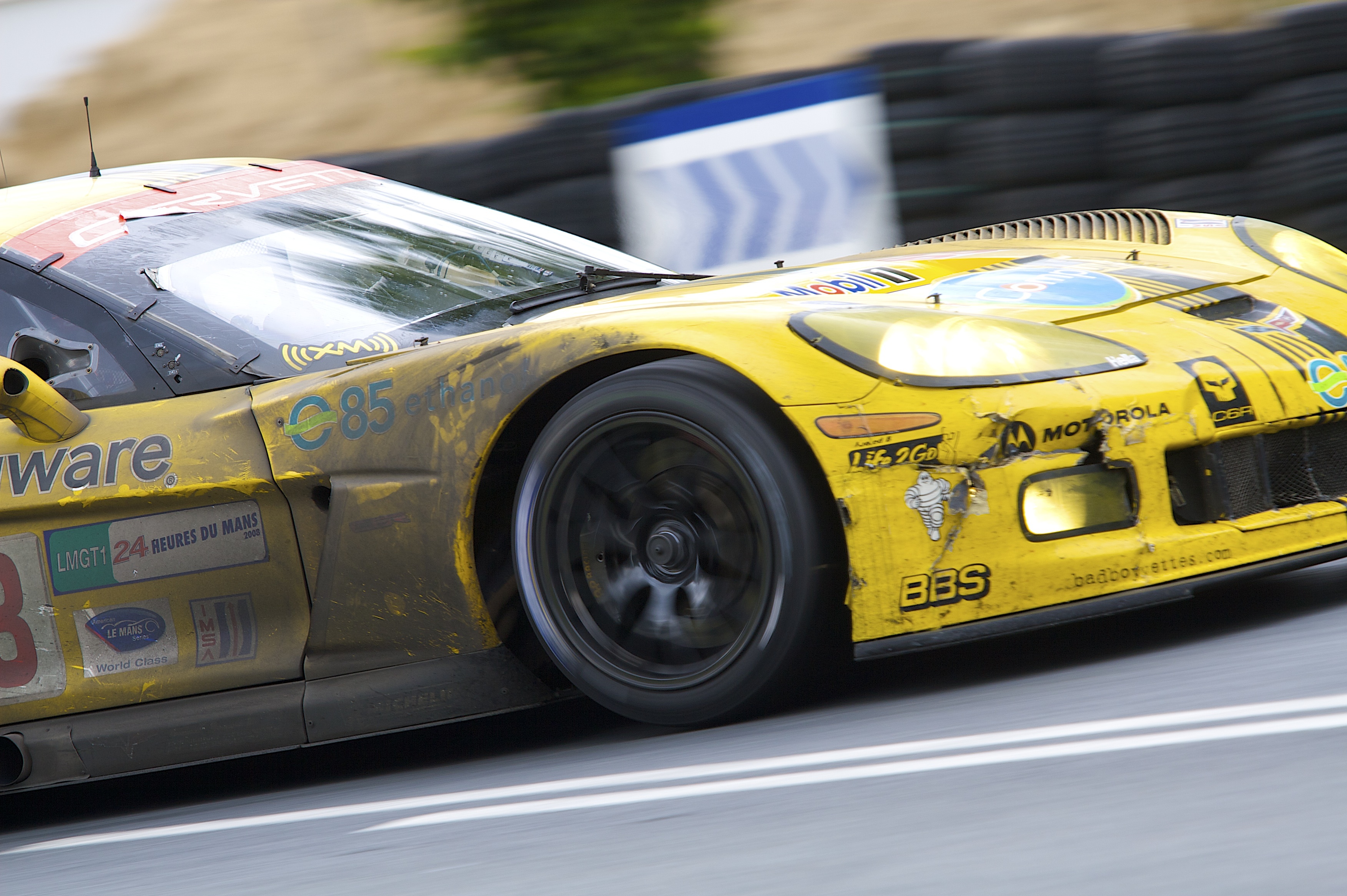 yellow race car in motion