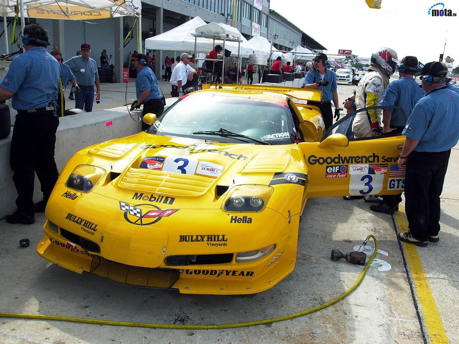 Yellow race car in pit stop