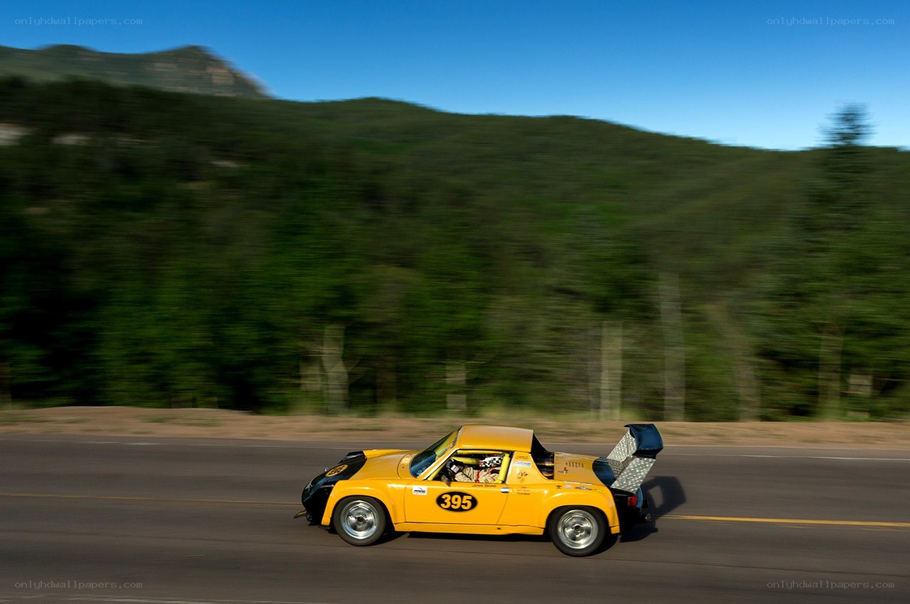 Yellow race car on a road