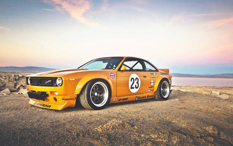 Yellow race car on beach