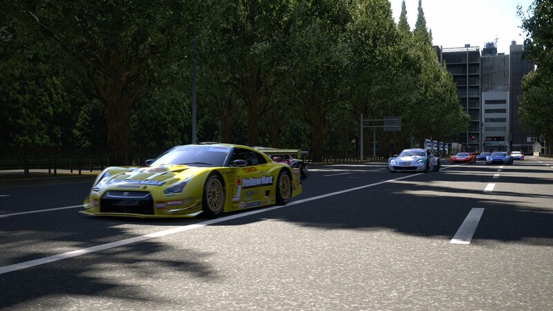 Yellow race car on city street