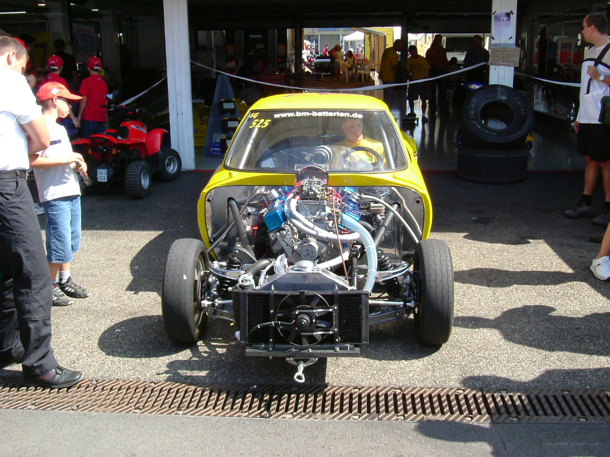 Yellow race car on display