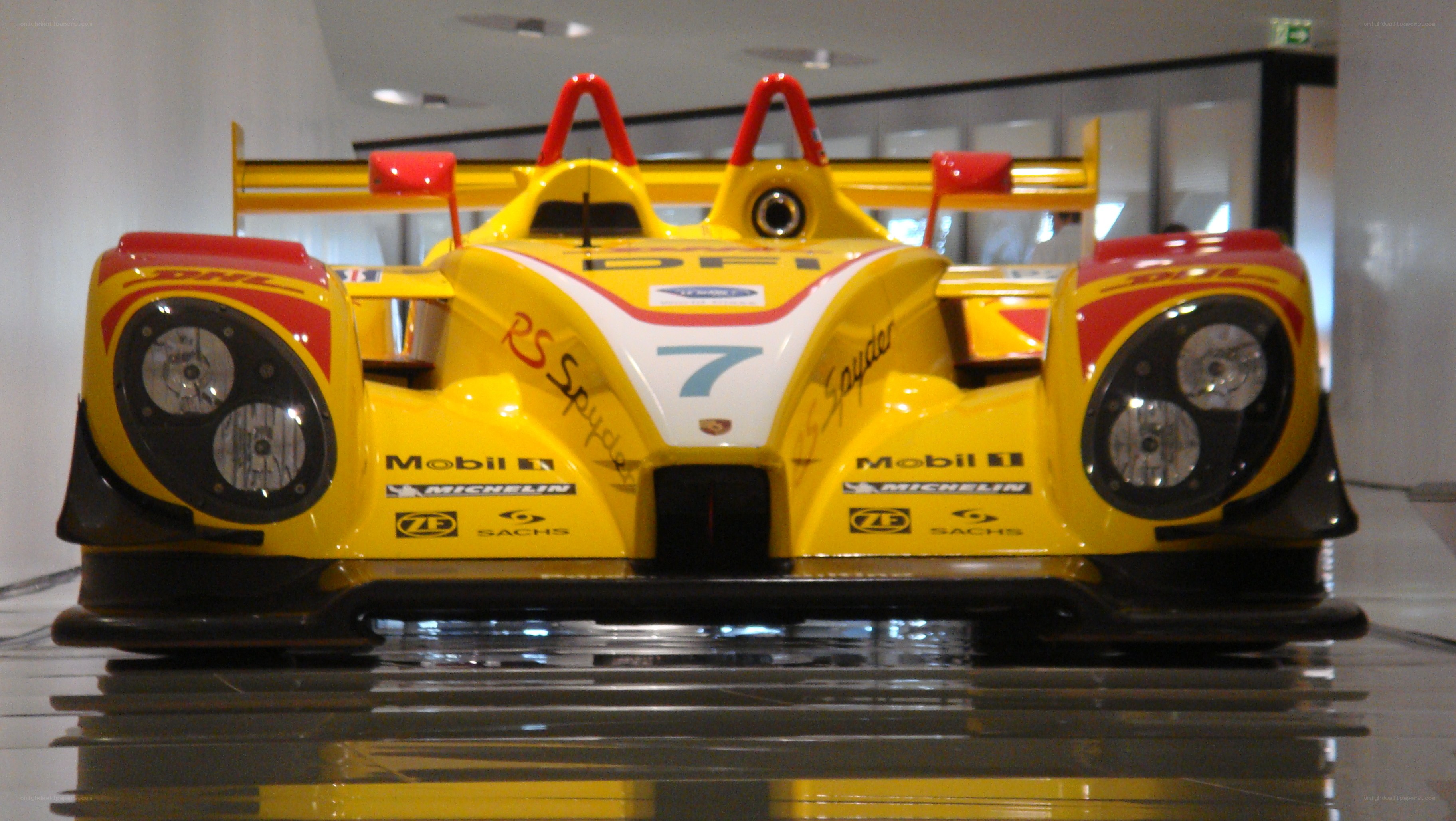 yellow race car on display
