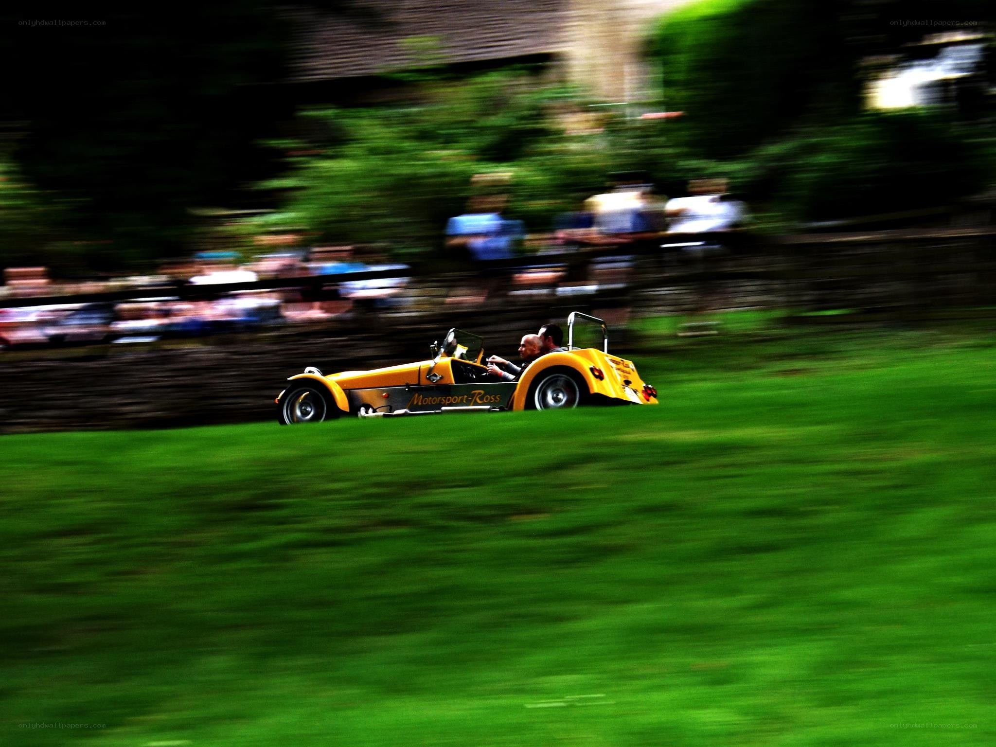 Yellow race car on grass