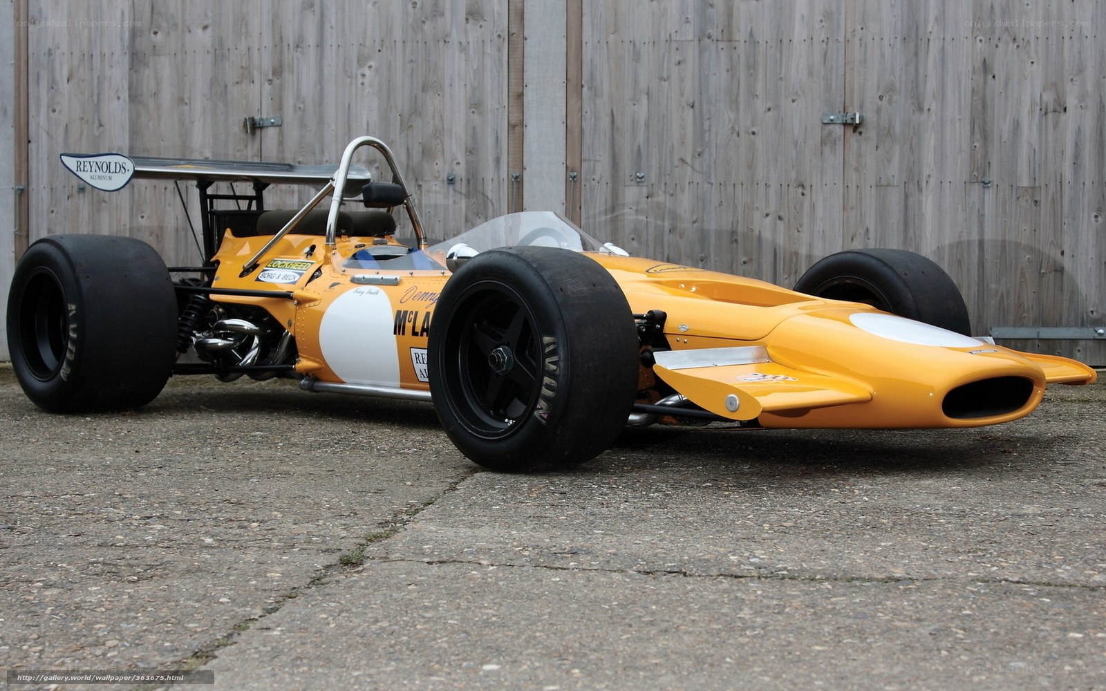 yellow race car on pavement