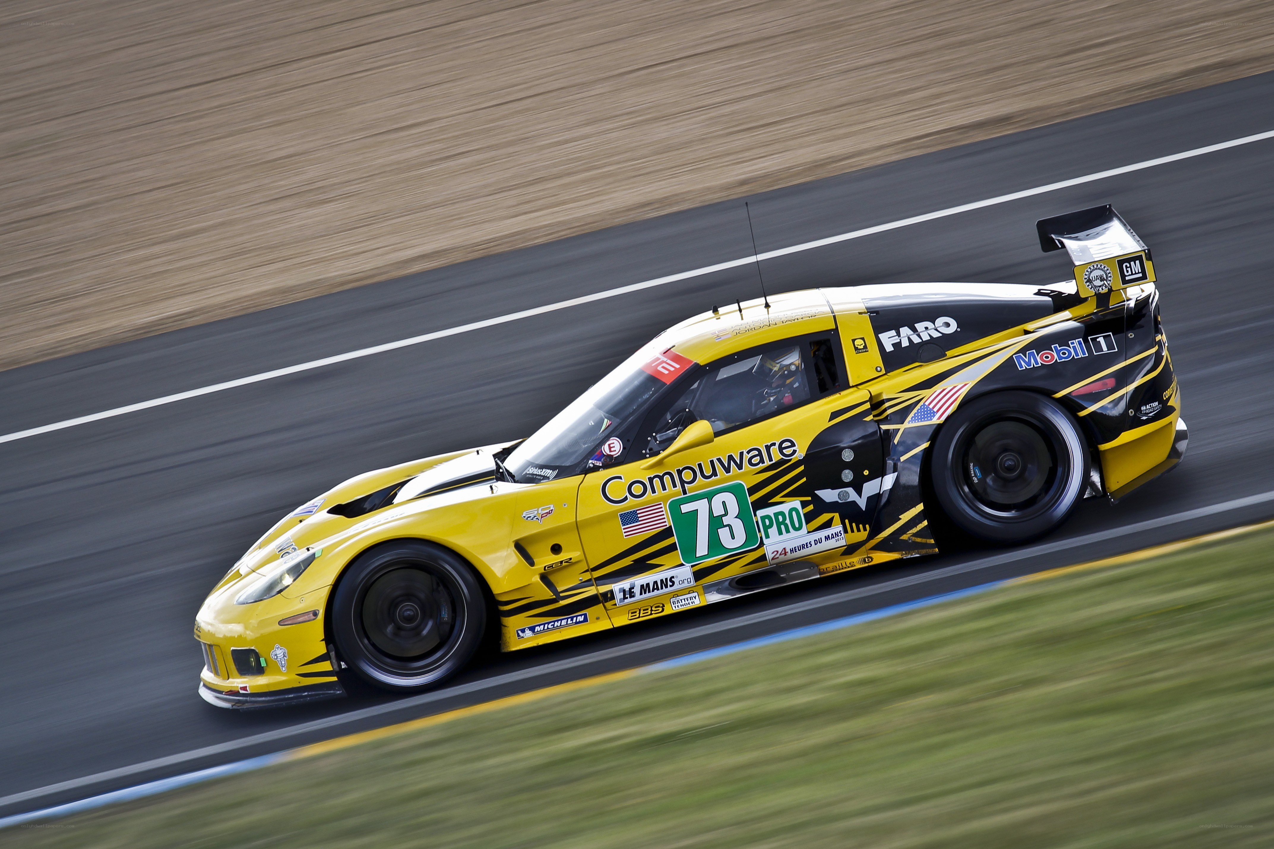 yellow race car on track