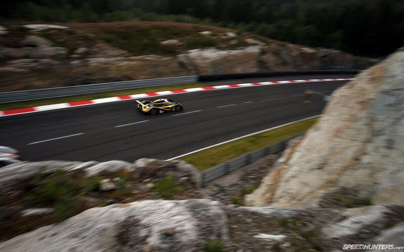 Yellow race car on track