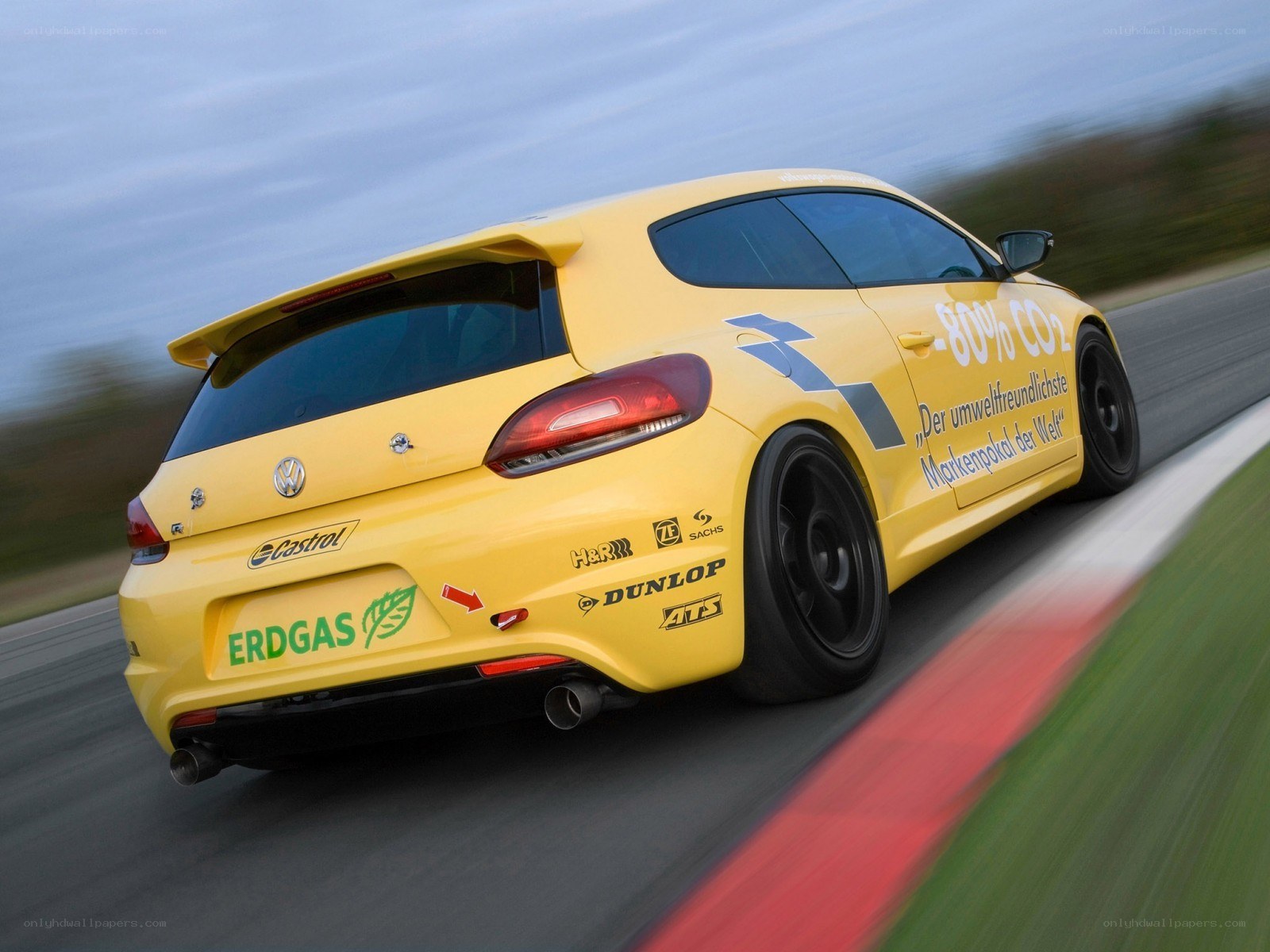 yellow race car on track