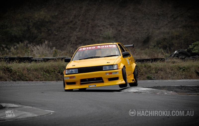 Yellow race car on track