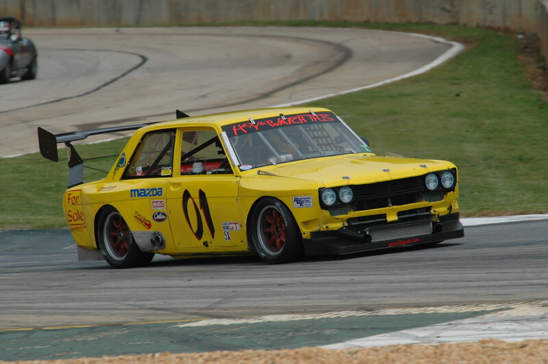 yellow race car on track