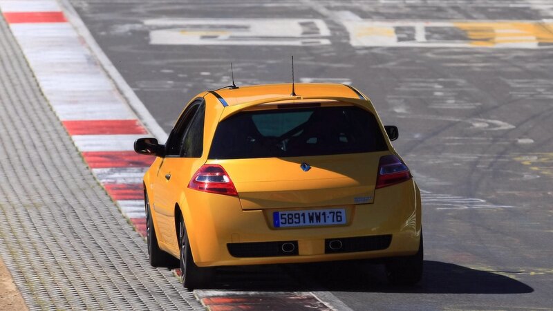 yellow race car on track