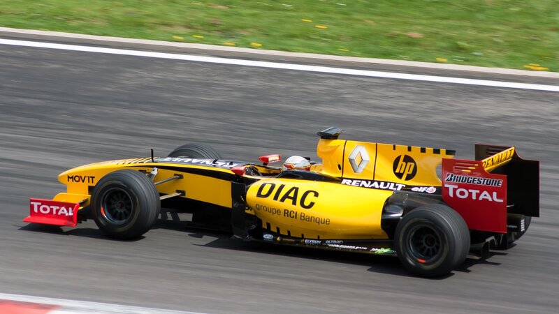 Yellow race car on track