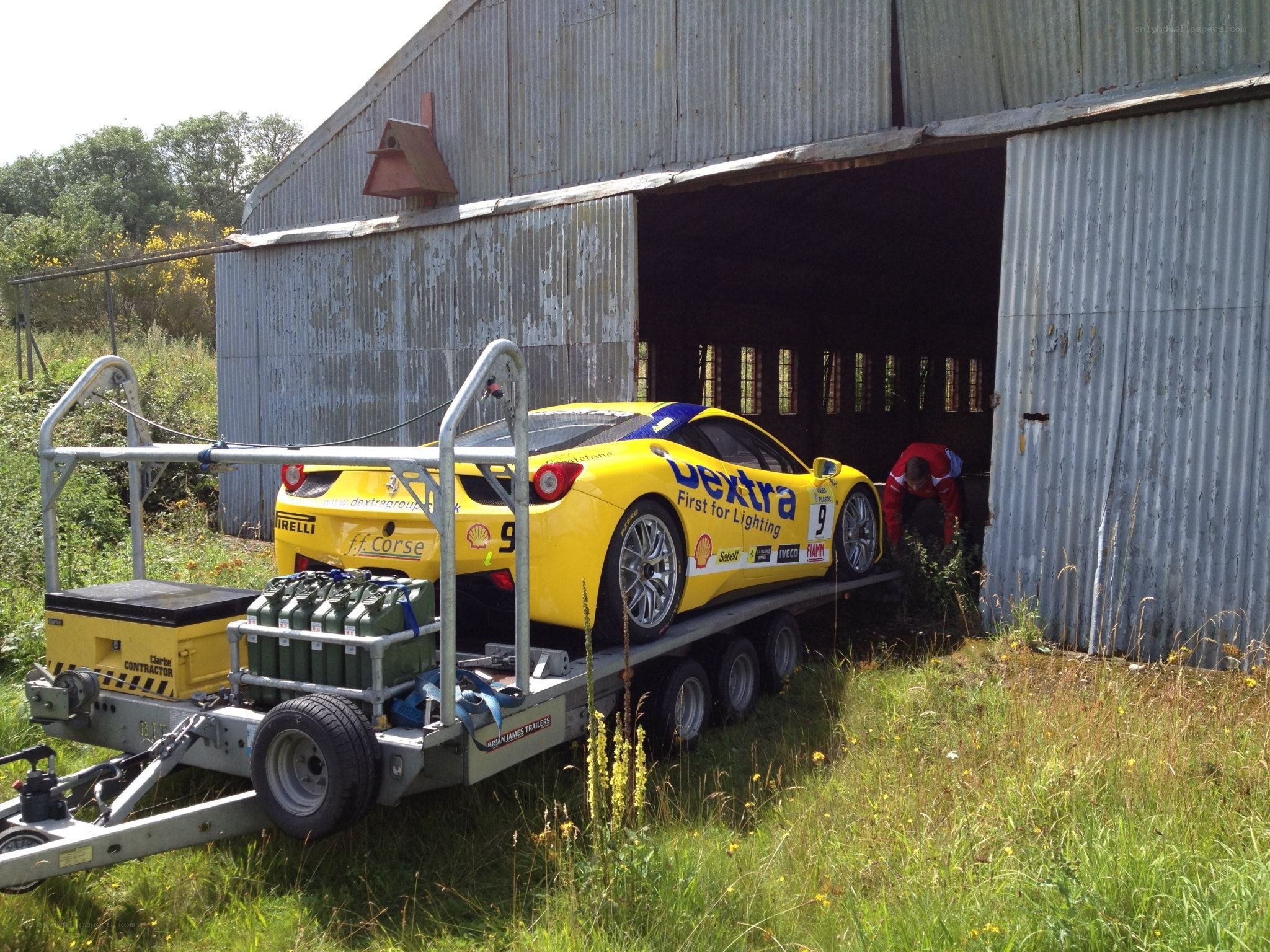 Yellow race car on trailer