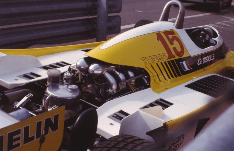Yellow race car with exposed engine