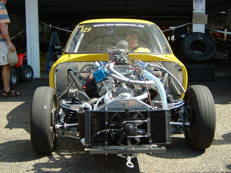 Yellow race car with exposed engine