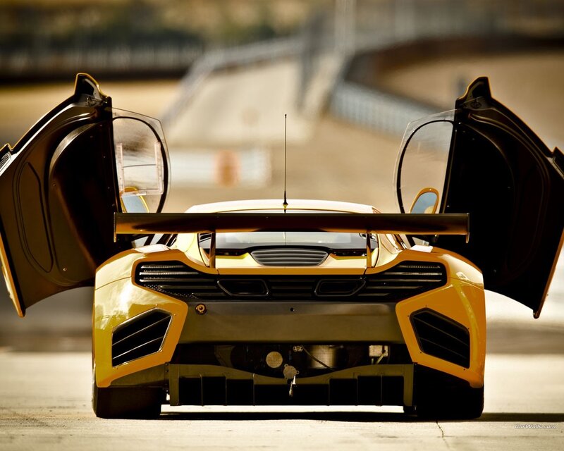 yellow race car with open doors