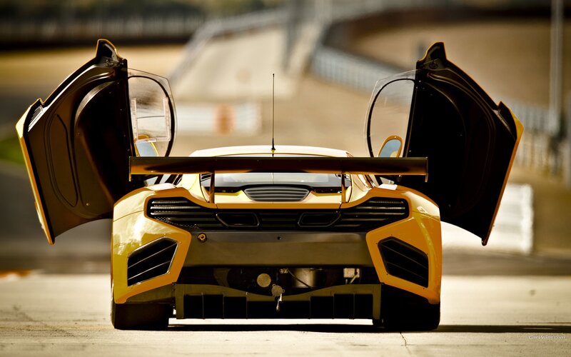 yellow race car with open doors