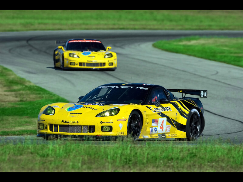 Yellow race cars on a track