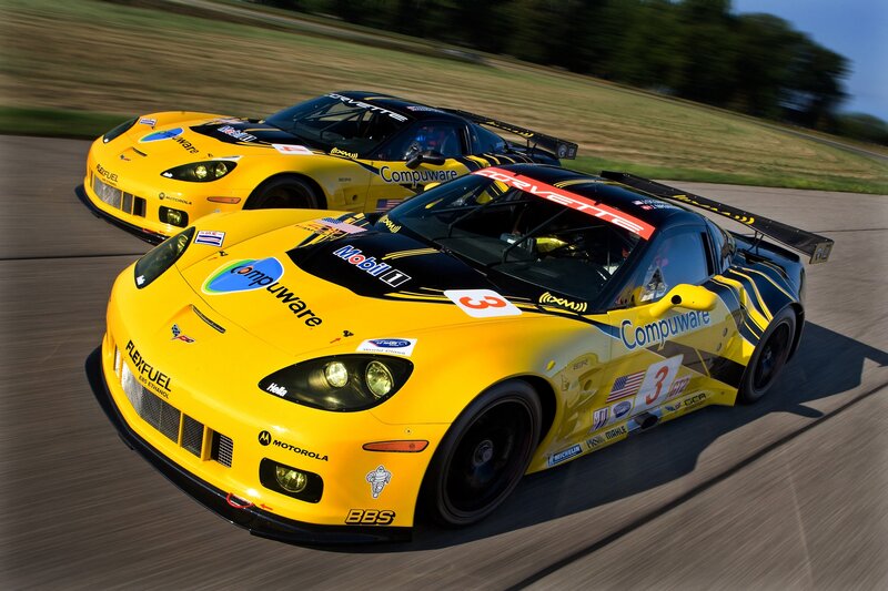Yellow race cars on a track