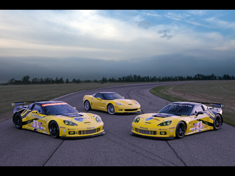 Yellow race cars on a track