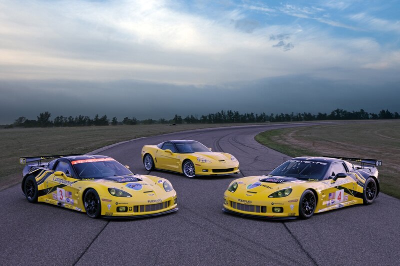 Yellow race cars on a track